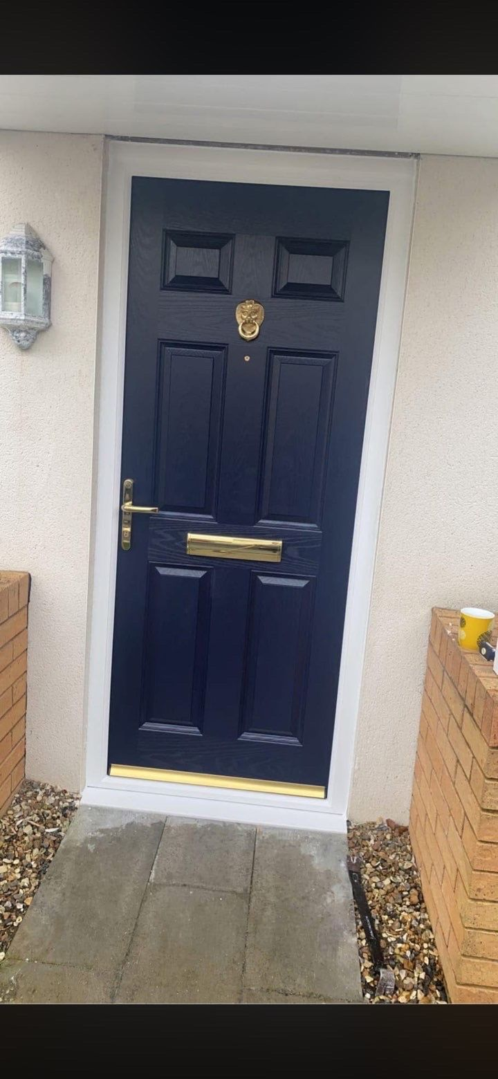Navy Door with Brass Hardware